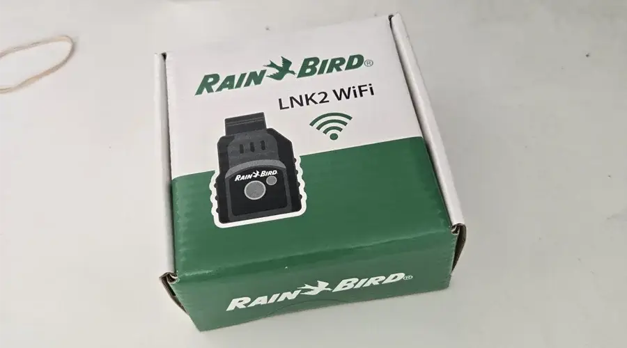 Rain Bird LNK2 WiFi smart irrigation controller box, featuring logo and WiFi symbol, emphasizing advanced landscape irrigation technology for efficient water management.