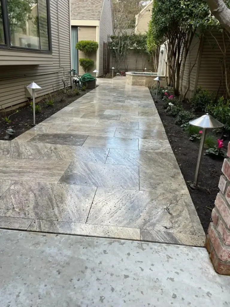 Close-up of hardscaping materials like pavers and natural stones in a landscaped area
