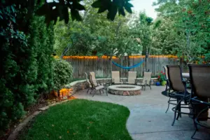 Outdoor living space with patio, fire pit, and seating area by Rogers Landscaping in Loomis, CA.