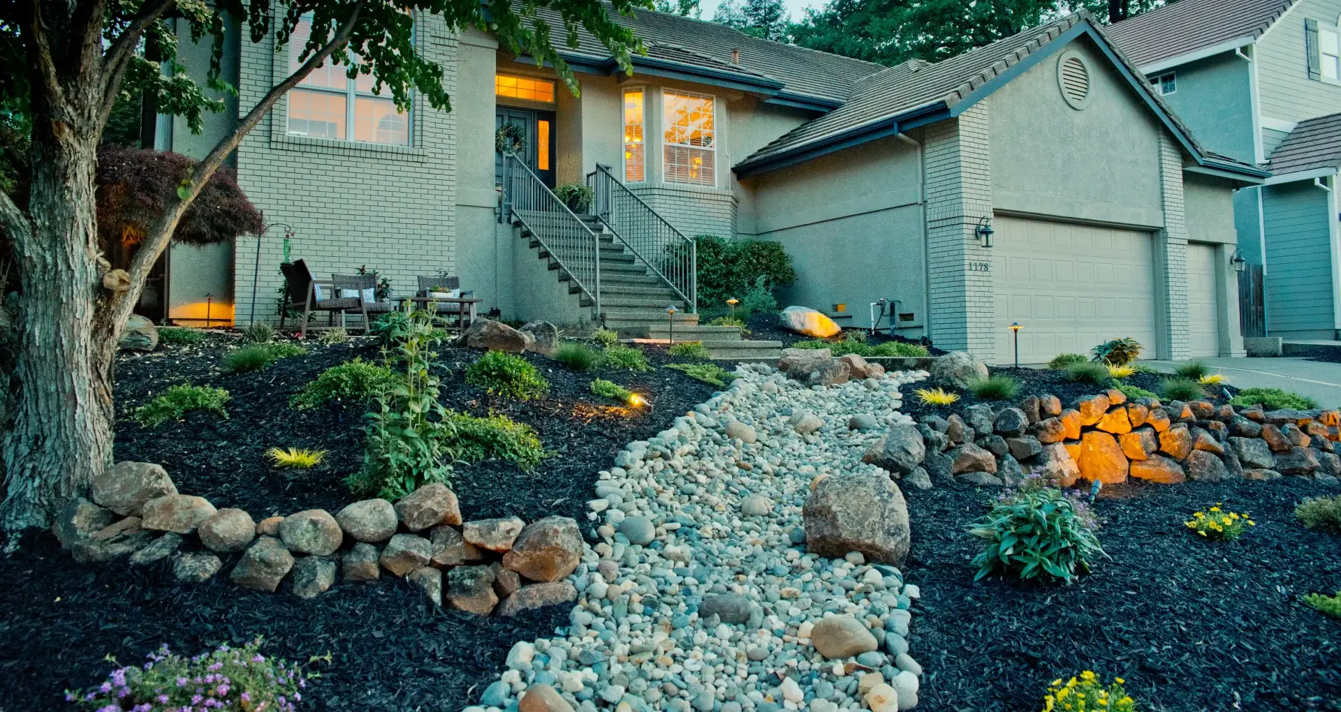 Gravel landscaping design and decorative rock features enhancing a Loomis, CA home.
