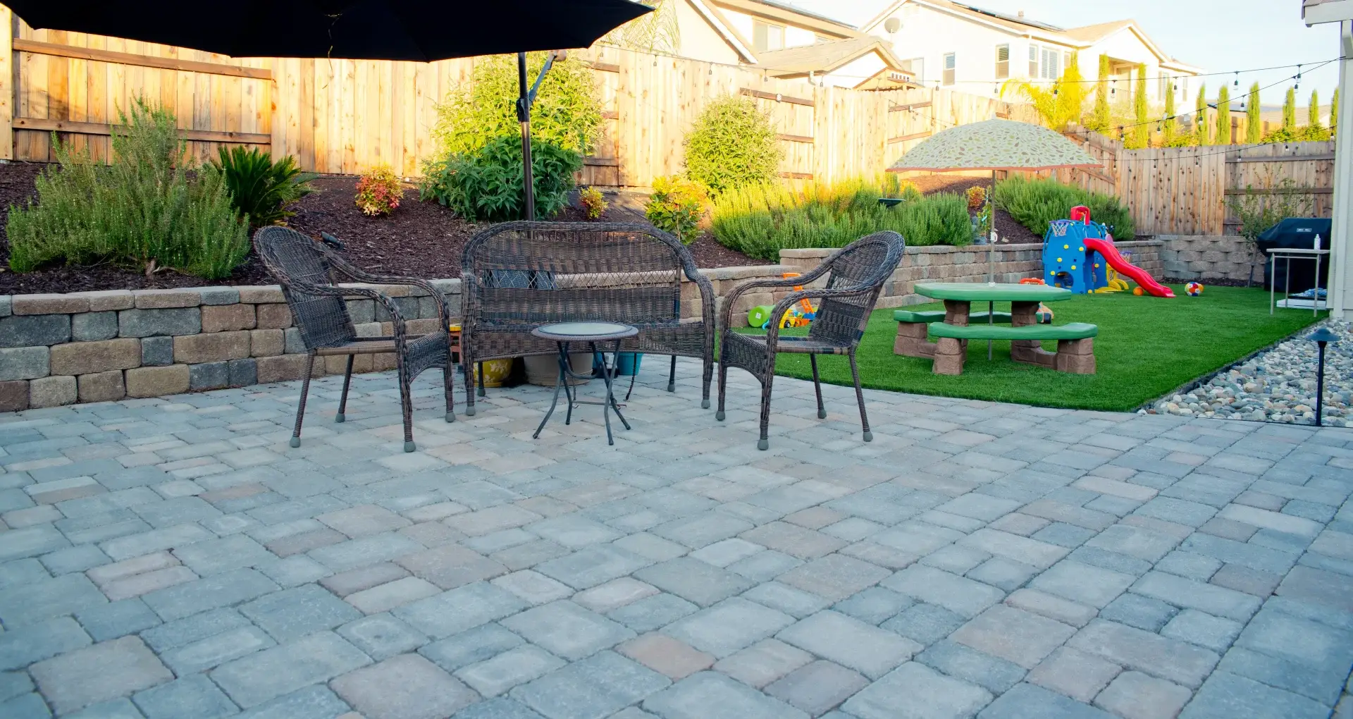 Paver patio and retaining wall with outdoor living space and seating area in Loomis, CA