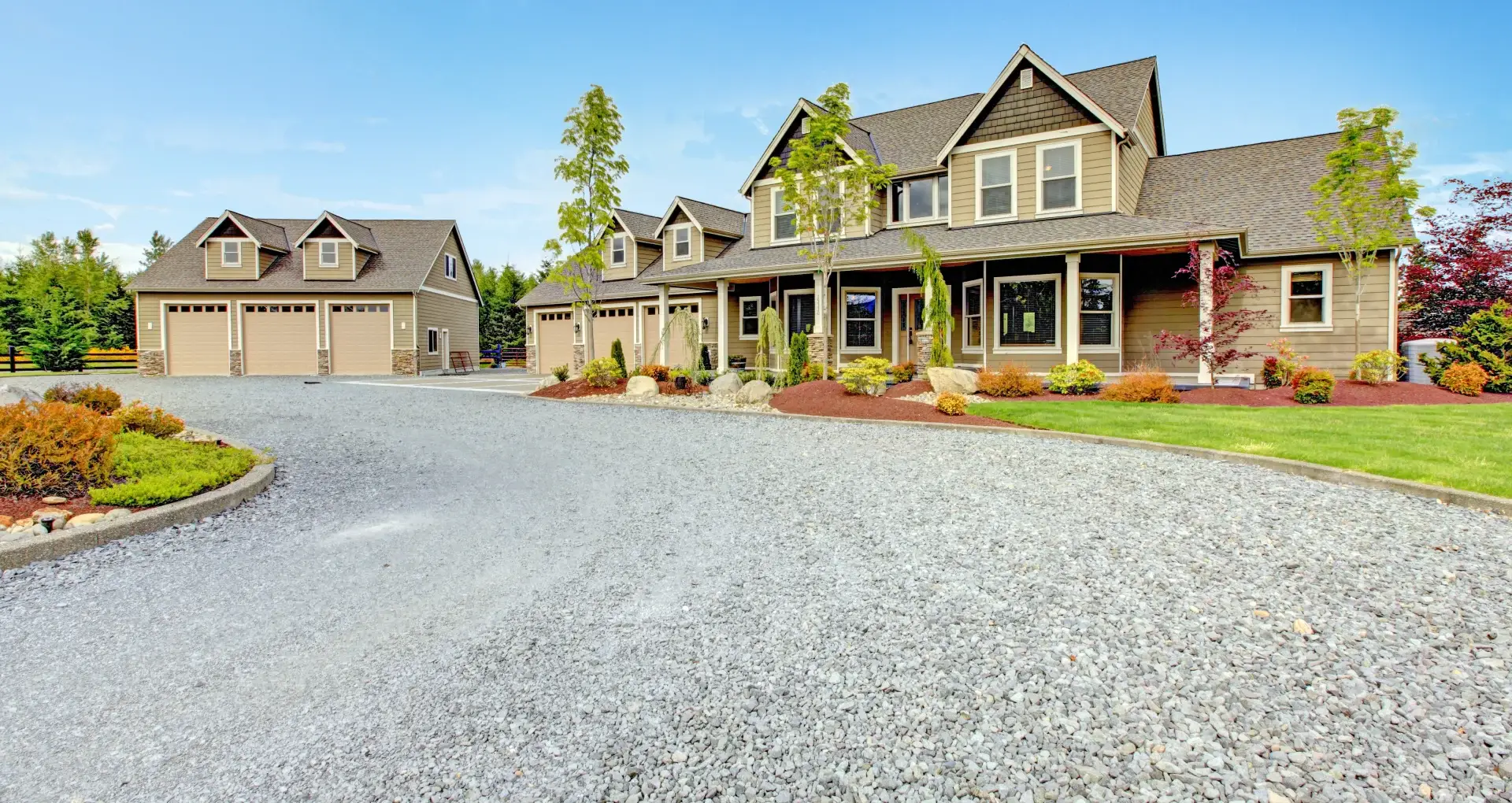 House with gravel driveway showcasing durable concrete driveway alternatives from Rogers Landscape in Loomis, CA.